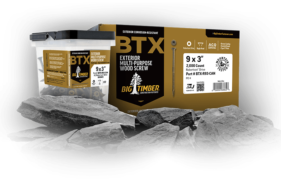 A box and plastic container of Big Timber BTX exterior multi-purpose wood screws are displayed with gray rocks in the foreground.