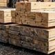 Stacked lumber at a lumberyard.